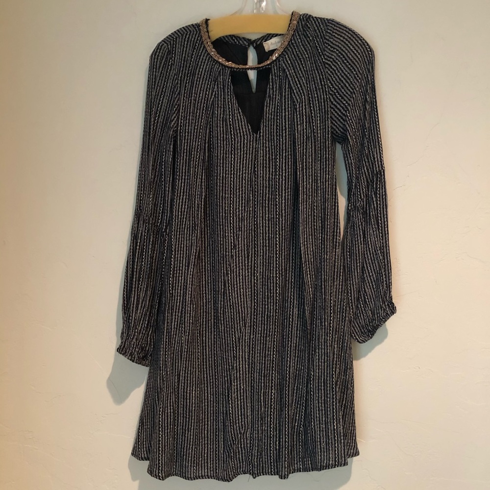 Black and white vert stipe dress with gold accent